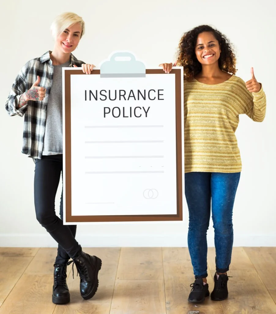 Two women holding a insurance policy paper craft